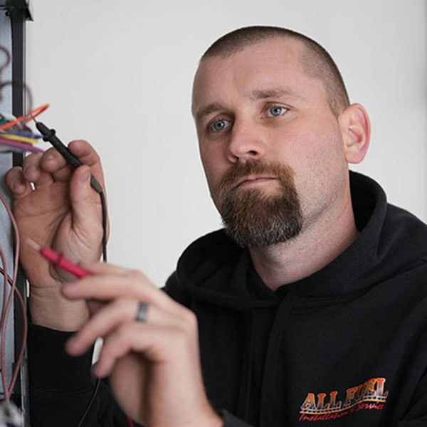 HVAC technician working on a HVAC system.
